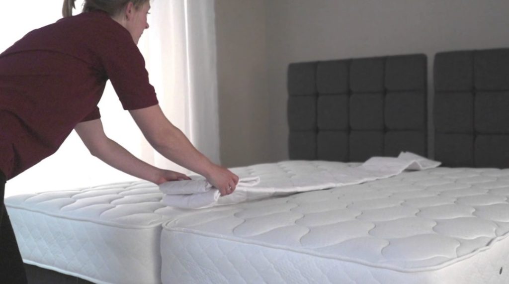 How do you secure two mattresses together?